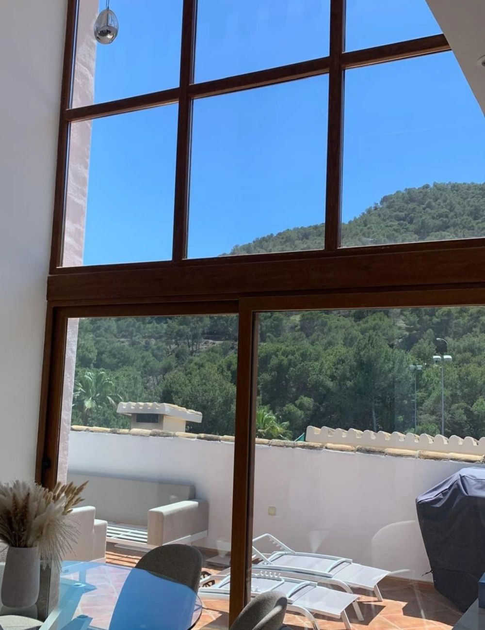Large residential windows ready for professional window film installation in Spain